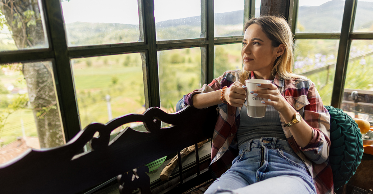 A woman sitting inside a cozy home