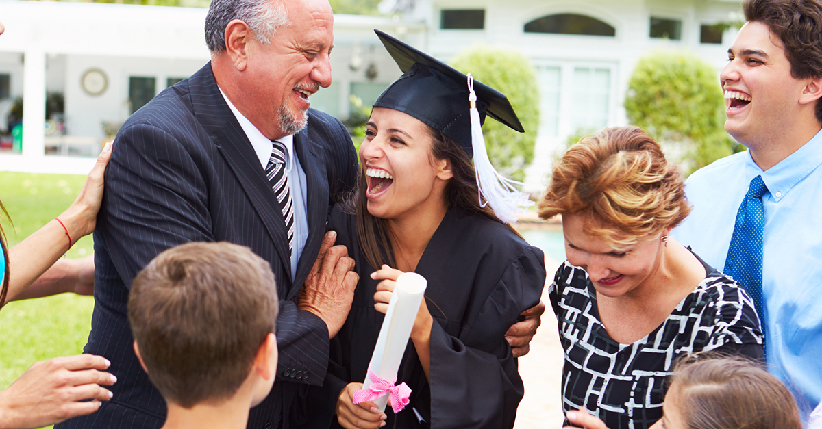 A recent college graduate celebrates with her family