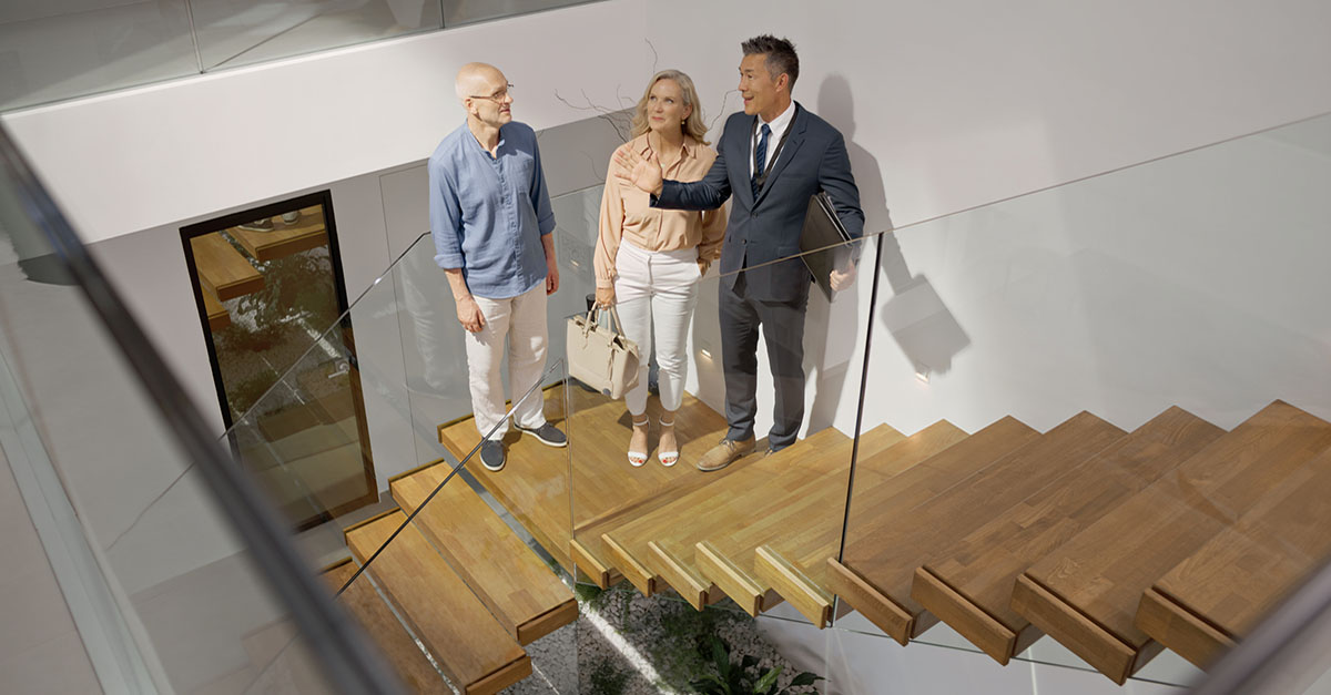 A couple touring a home with an agent